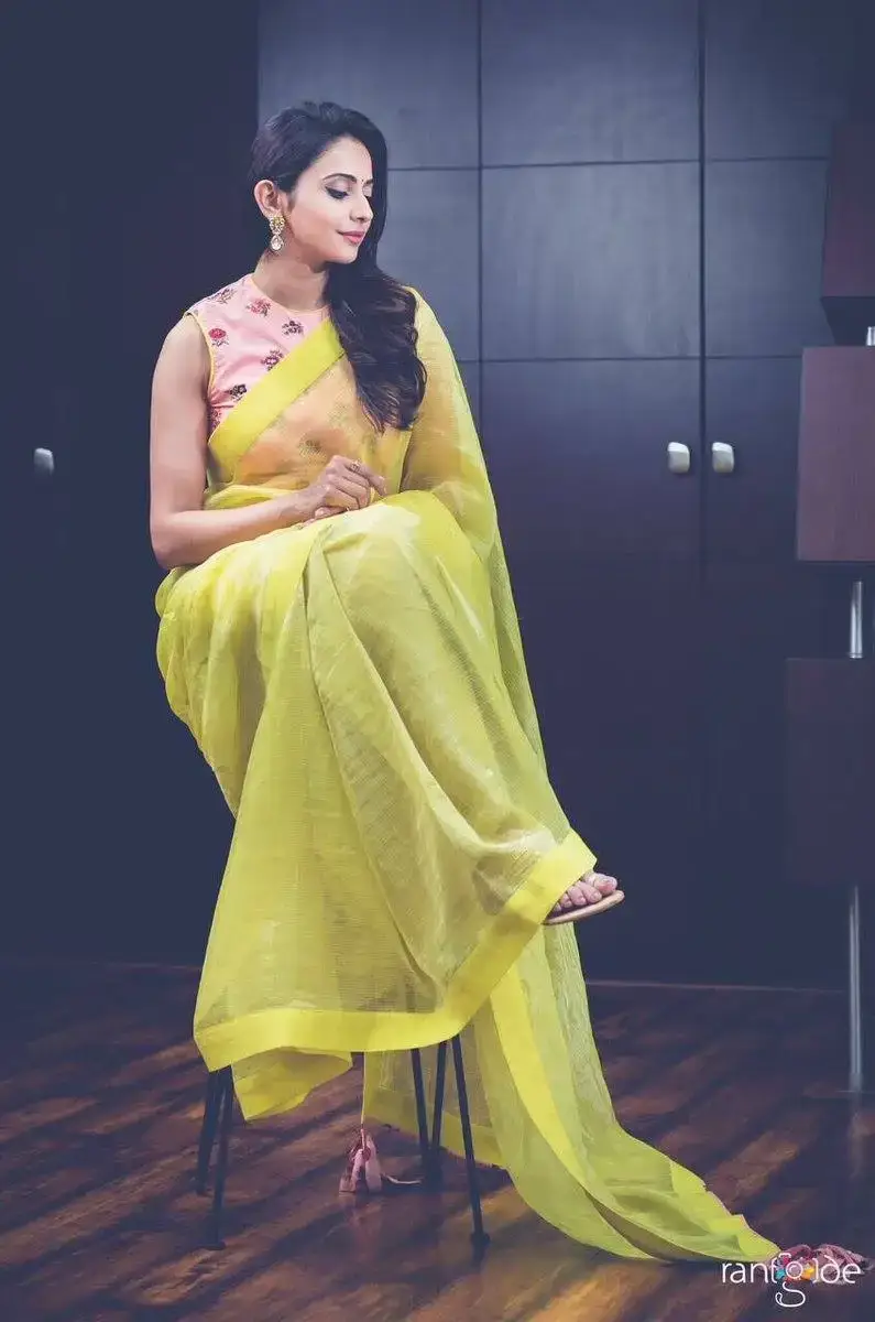 RAKUL PREET SINGH STILLS IN YELLOW SAREE 3